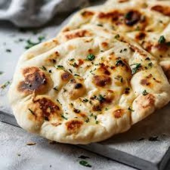 Taj Mahal Indian Kitchen Deals - Malta Food & Drink Discounts & Offer on Coupon Club.mt - Spend €20, Get a Free Garlic Naan